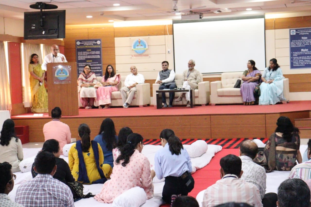 Inaugural session with dignitaries on stage, PCCoE